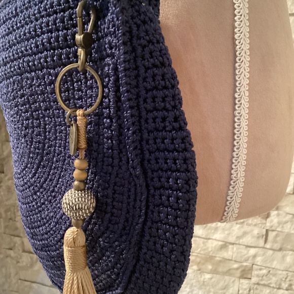 The Sak Ryder crochet crescent crossbody bag in navy blue with a tassel - Picture 5 of 14